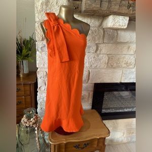 Dress with scalloped edges.